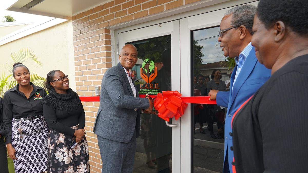 Celebrating 20 years of helping others, C.A.R.E. Inc. opened its new building in Miami Gardens. From left, C.A.R.E. Inc. Executive Director Lataya Dennis-Hall; C.A.R.E. Inc. board chair Michelle-Ann Neita; Miami Gardens Mayor Oliver Gilbert, president of C.A.R.E. Inc.; Pastor Robert Stewart of Pentecostal Tabernacle; and Miami Gardens Crime Watch President Hortense McGilvery.
