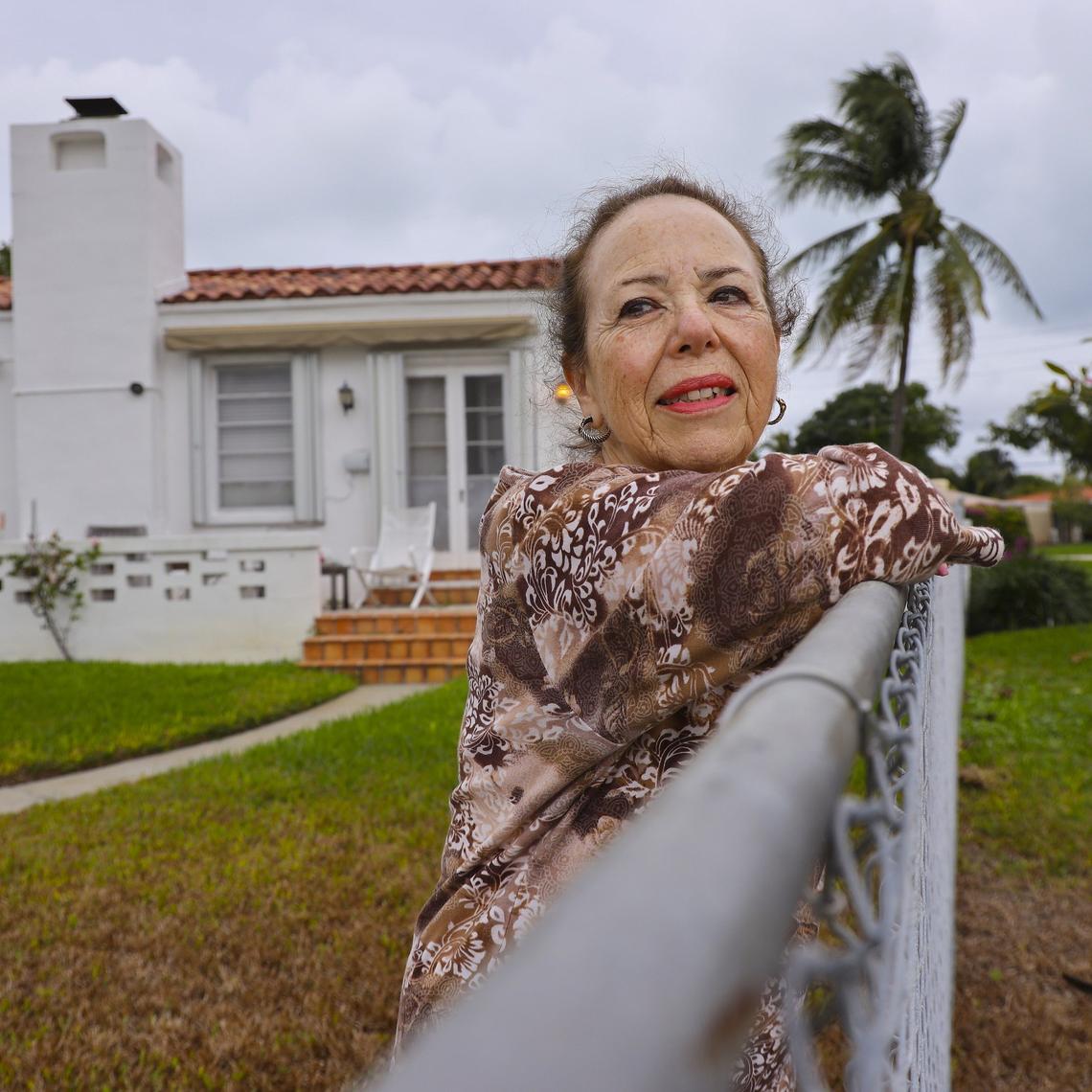 Daryle Prager, 81, stands in her backyard where her lawn has turned brown due to the constant flooding by sea rise on Sunday, December 22, 2019.