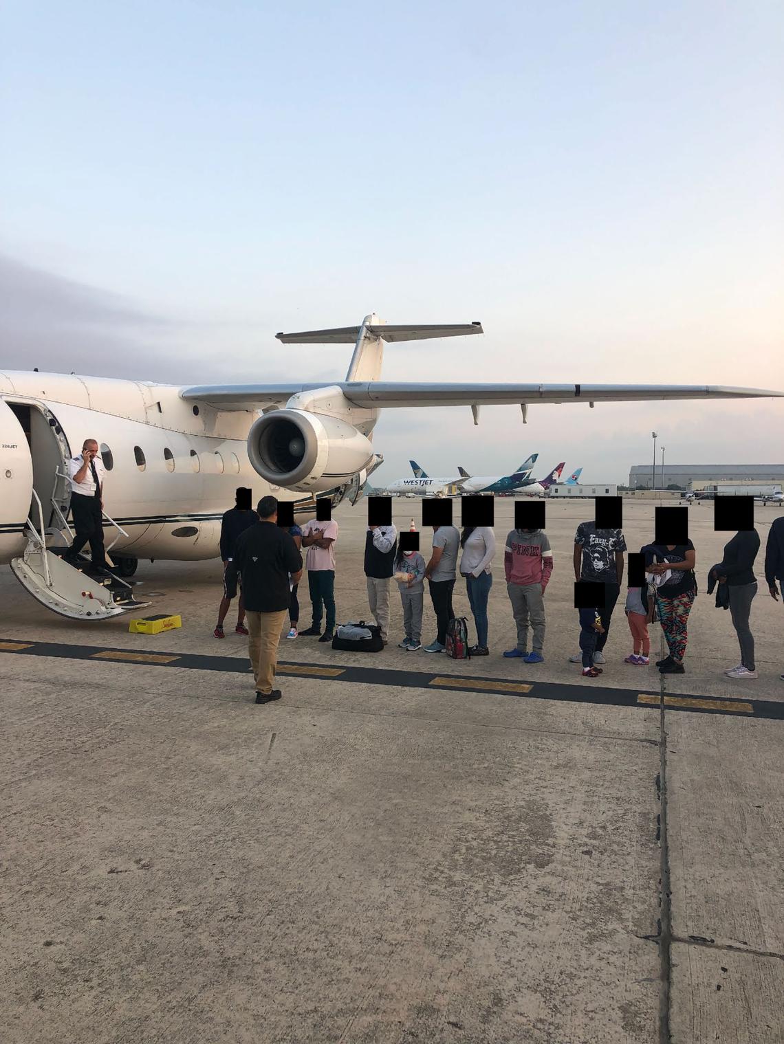 Migrants, their faces obscured, outside the plane that ferried them from Texas to Martha’s Vineyard, Massachusetts. Florida taxpayers paid for the charter.
