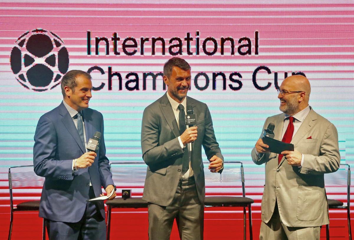 From left to right, ESPN personality Max Bretos,  A.C. Milan legend Paolo Maldini, middle, and Executive Chairman of Relevent Sports Charlie Stillitano introduce the 18 teams that will play in the international Champions Cup at Hard Rock Stadium on Tues., April 18, 2018.