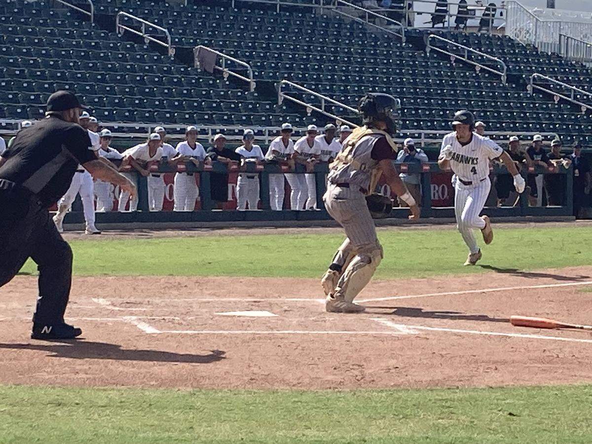 With Miami Springs catcher Jovani Zara awaiting the throw, South Walton’s Declan Fowler races home with the game’s first run in the second inning of Wednesday’s Class 3A baseball state semifinal at Hammond Stadium in Fort Myers.