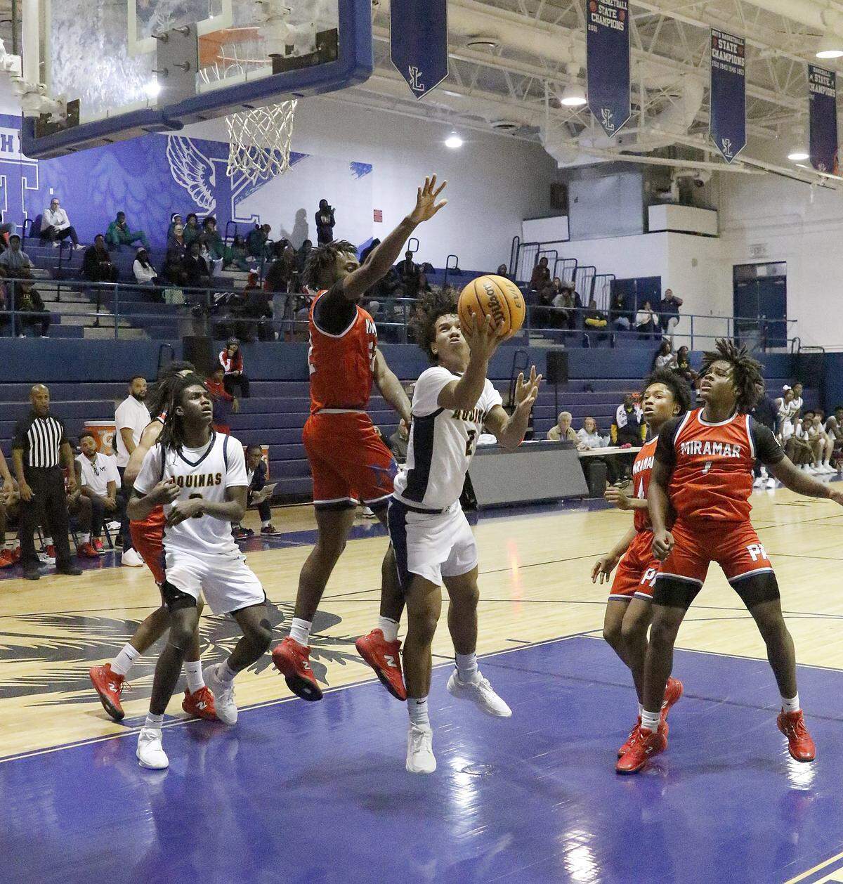 St. Thomas Aquinas Raiders Drake [DJ]Sandi (2) attempts to score against Miramar Patriots during the BCAA Big 8 boys basketball tournament final game on Saturday, January 31, 2026 at Fort Lauderdale HS in Fort Lauderdale. Andrew Uloza / for Miami Herald