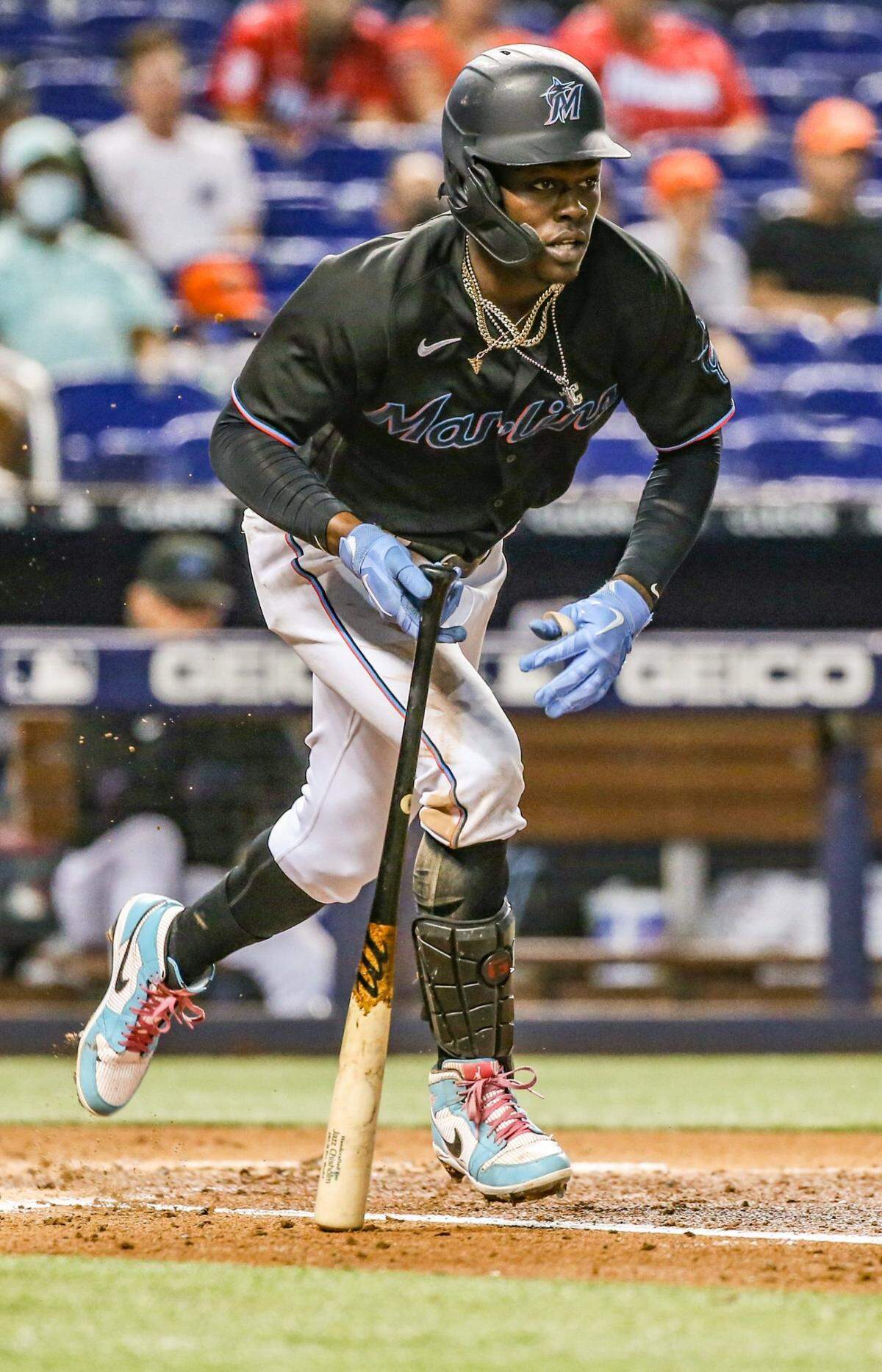 Miami Marlins second baseman Jazz Chisholm Jr. (2) watches the ball after hitting in the fourth inning as the Miami Marlins host the Cincinnati Reds at loanDepot park in Miami on Friday, August 27, 2021.