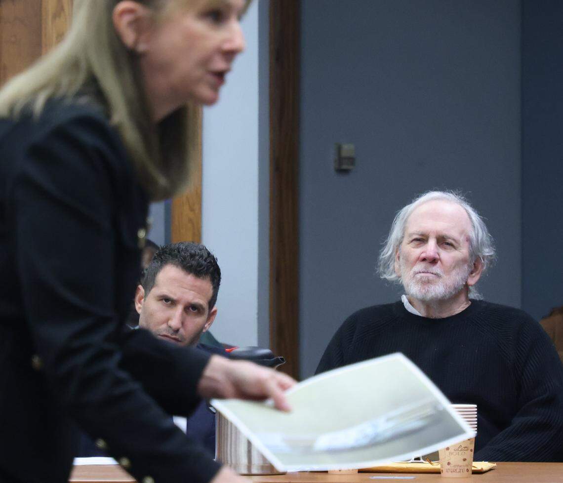 Defense attorneys Alex Klayman, center, and Robert Koehler, right, listen closely to the opening argument of prosecutor Laura Adams, left, as she presents evidence to the jury during Koehler's trial in Courtroom 7-3 with Judge David Young presiding on October 28, 2025 at the Richard E. Gerstein Justice Building in Miami, Florida.