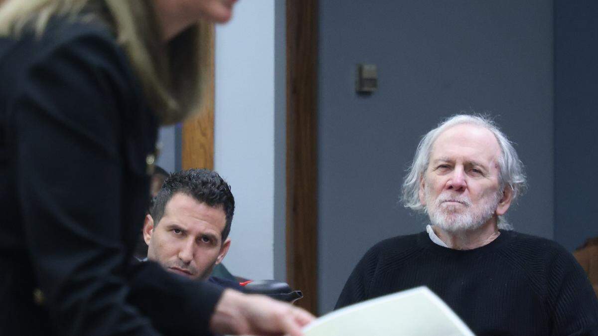 Defense attorneys Alex Klayman, center, and Robert Koehler, right, listen closely to the opening argument of prosecutor Laura Adams, left, as she presents evidence to the jury during Koehler's trial in Courtroom 7-3 with Judge David Young presiding on October 28, 2025 at the Richard E. Gerstein Justice Building in Miami, Florida.