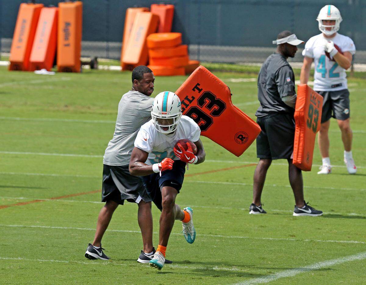 Miami Dolphins running back Kenyan Drake (32) runs drills during the Miami Dolphins Organized Team Activities at the Baptist Health Training Facility at Nova Southeastern University on Tuesday, May 21, 2019 in Davie.