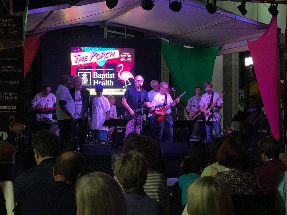 Crime writer Greg Iles sings a solo with Dave Barry, Carl Hiaasen and other Rock Bottom Remainders at the 2019 Miami Book Fair at Miami Dade College.