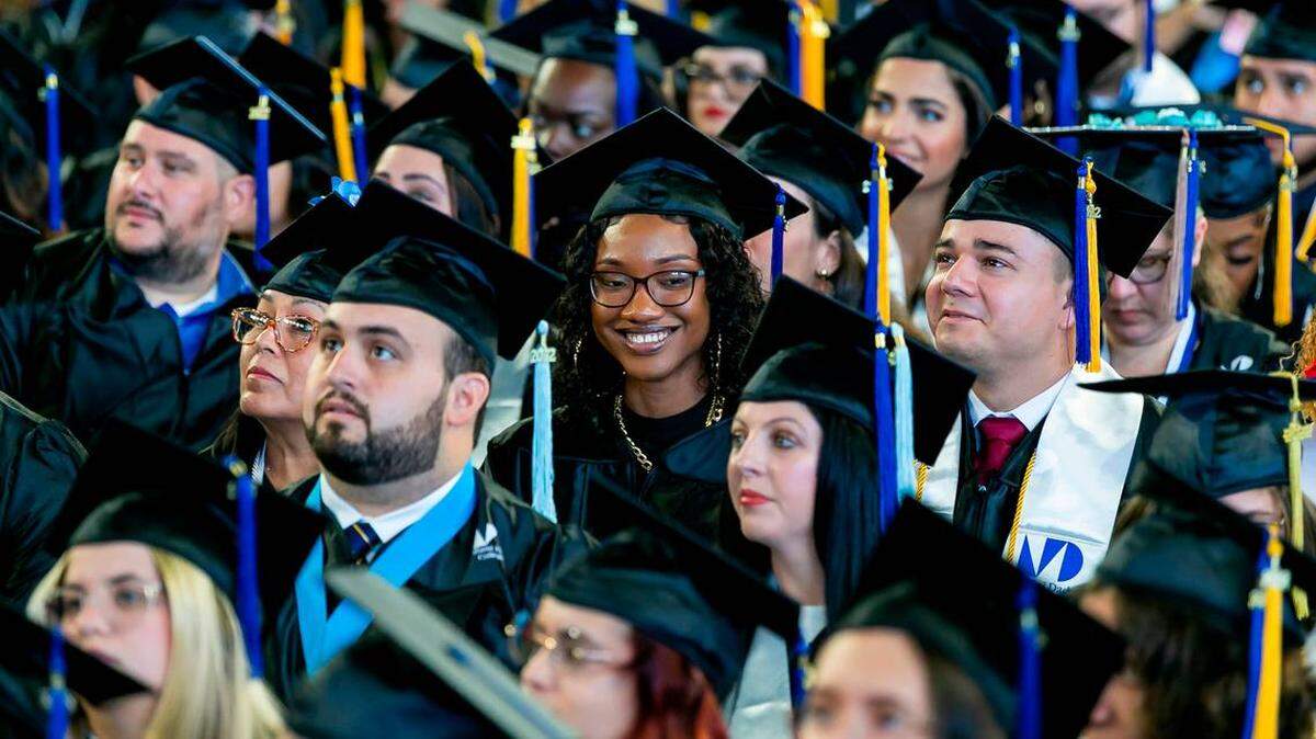Miami Dade College students at their graduation ceremony inside loanDepot Park in Miami in 2022.