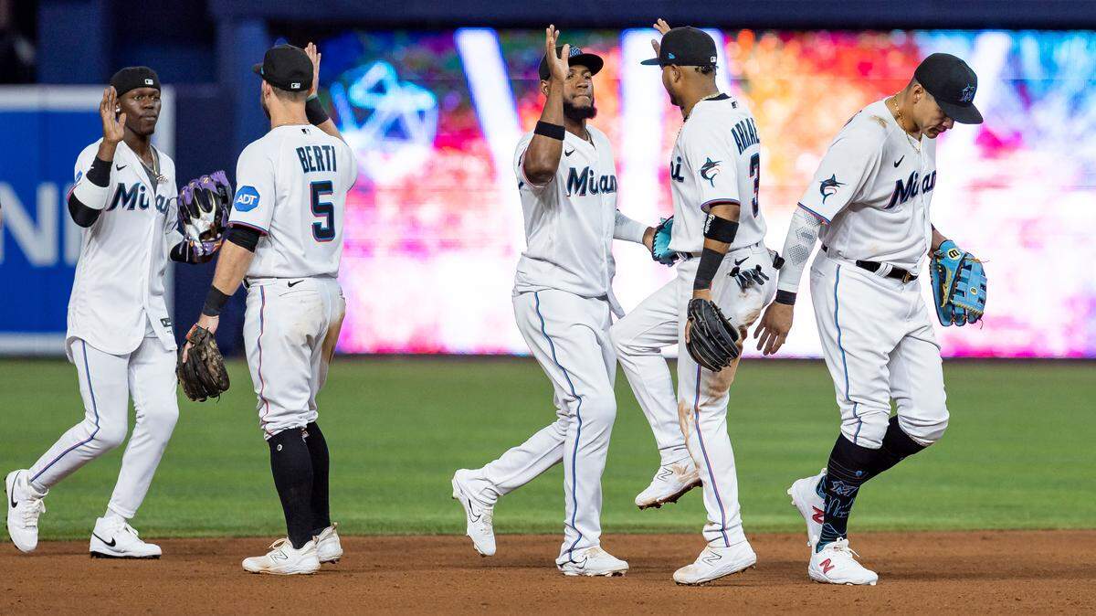 Miami Marlins players celebrate after defeating the Minnesota Twins 1 to 0 during an MLB game at loanDepot park on Tuesday, April 4, 2023, in Miami, Fla.