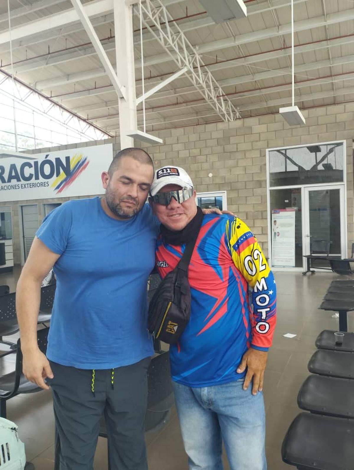 Colombian activist Jonatan Palacios (left) with friend after being release from a Venezuelan prision.