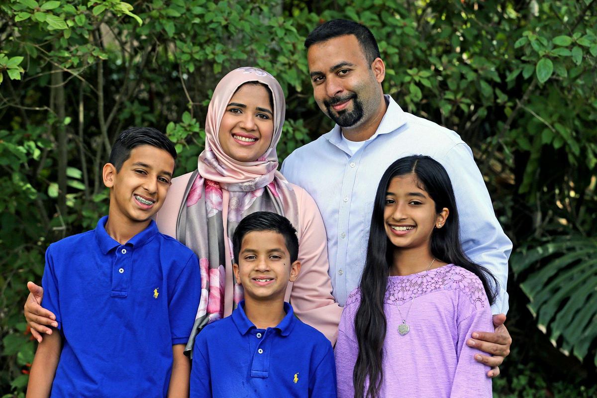 Tehsin Siddiqui and Azhar Dalal with their children, Ameen Dalal, 12, Hamza Dalal, 8, and Noor Dalal, 10, at their home in Davie on April 23, 2020.