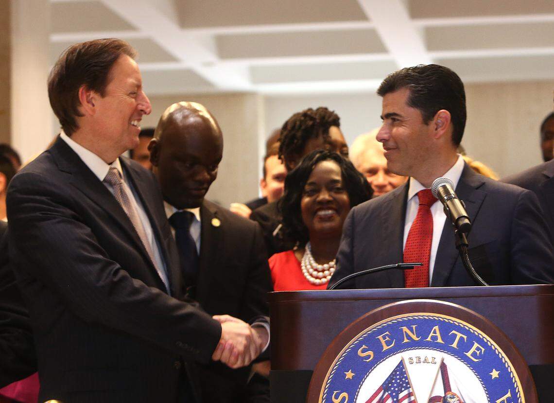 SCOTT KEELER | Times Senate President Bill Galvano, R- Bradenton, congratulates House Speaker Jose Oliva, R- Miami Lakes during the Sine Die ceremony at the Capitol in Tallahassee, Saturday, May 4, 2019.