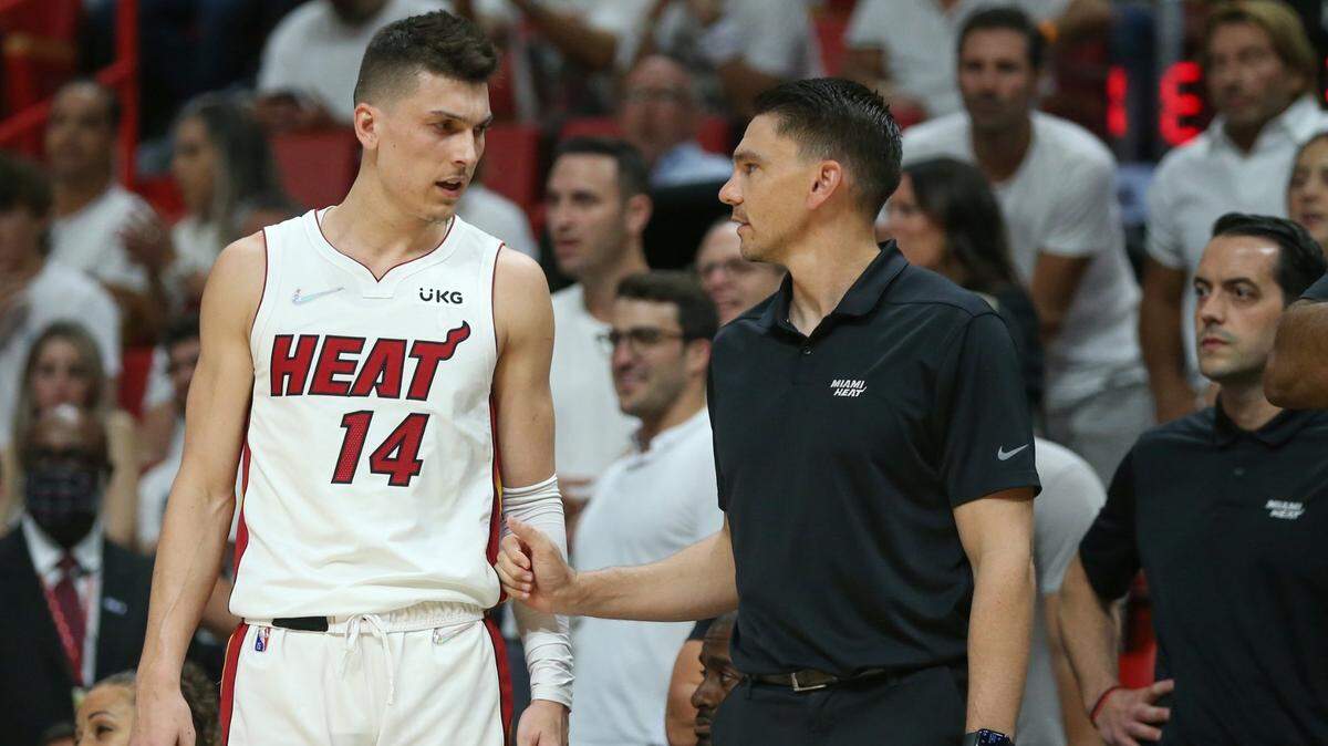 Miami Heat guard Tyler Herro (14) speaks with assistant coach Chris Quinn during a game against the Philadelphia 76ers during the NBA Playoffs: Round 2, Game 5 at FTX Arena in Miami on May 10, 2022.