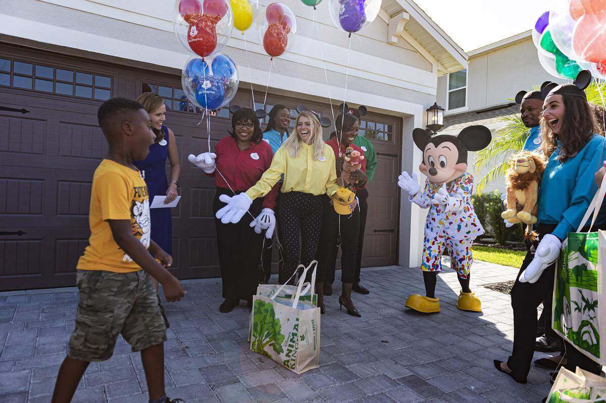 Jermaine Bell, 7, was surprised to see Mickey Mouse show up at his birthday party Sept 8, 2019, in Kissimmee, Fla. Mickey and Walt Disney World cast members were there to honor Bell with a VIP getaway to the theme park later this month after he used his the money he’d saved for a Walt Disney World vacation to feed people fleeing Hurricane Dorian.
