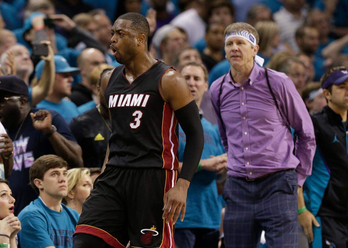 Miami Heat’s Dwyane Wade (3) reacts after making a 3-point basket against the Charlotte Hornets during the second half in Game 6 of an NBA basketball playoffs first-round series in Charlotte, N.C., Friday, April 29, 2016. The Heat won 97-90. (AP Photo/Chuck Burton)