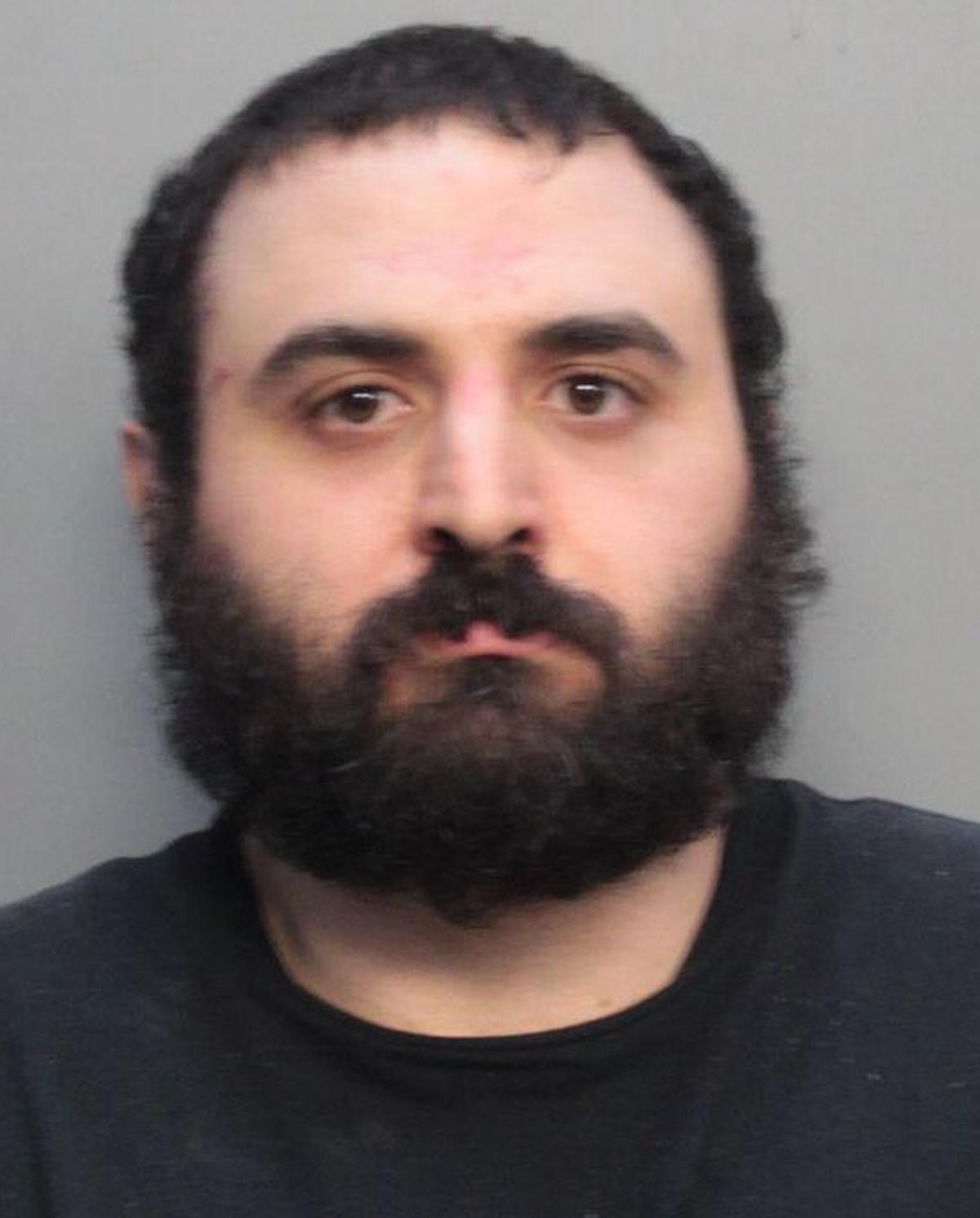 Aramis Khosrabi, 32, was charged with trying to kill 10 Miami-Dade police officers during a shootout Tuesday night. His father says the man is schizophrenic and never should have been able to obtain a weapon. He urged President Trump and Fla. Gov. Ron DeSantis to take action.