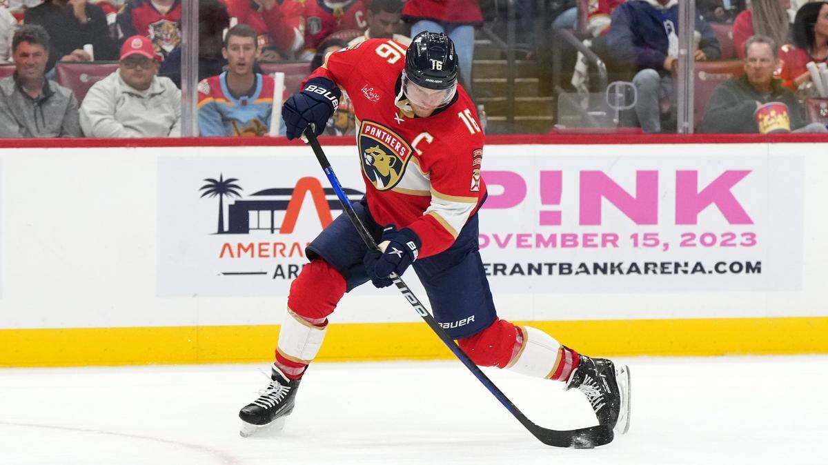 Oct 19, 2023; Sunrise, Florida, USA; Florida Panthers center Aleksander Barkov (16) shoots the puck against the Toronto Maple Leafs during the second period at Amerant Bank Arena. Mandatory Credit: Jasen Vinlove-USA TODAY Sports