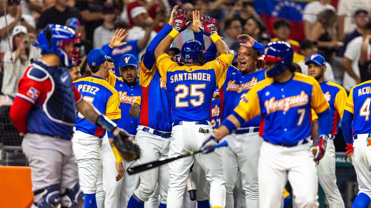 Venezuela base runner Anthony Santander (25) reacts with teammates after homering during the second inning of a 2023 World Baseball Classic game against Dominican Republic at loanDepot Park in Miami, Florida, on Saturday, March 11, 2023.