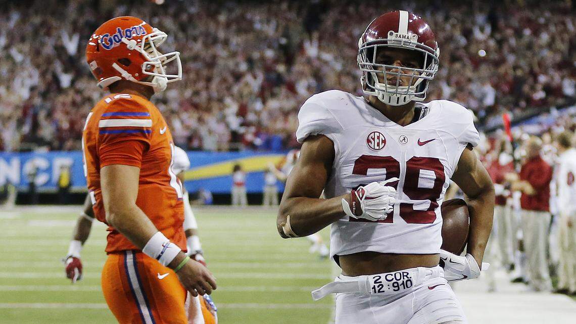 Alabama defensive back Minkah Fitzpatrick (29) runs into the end zone for a touchdown against Florida after an interception during the first half of the Southeastern Conference championship NCAA college football game, Saturday, Dec. 3, 2016, in Atlanta