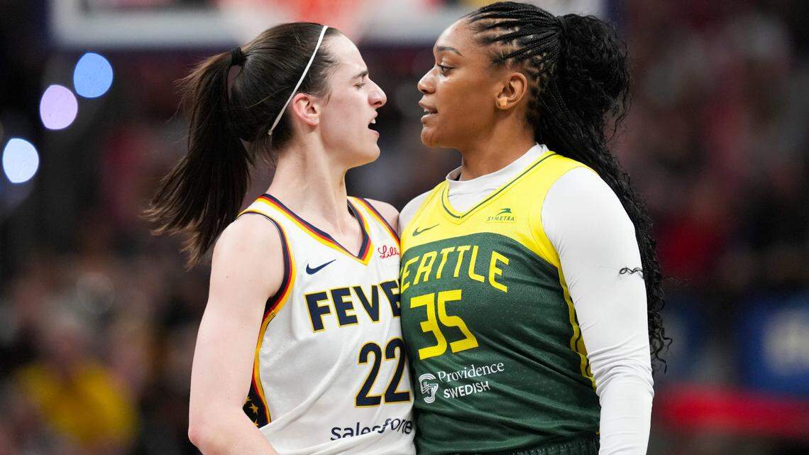 Indiana Fever guard Caitlin Clark (22) talks to Seattle Storm guard Victoria Vivians (35) following being run into after making a three-pointer, Thursday, May 30, 2024, during the WNBA game at Gainbridge Fieldhouse in Indianapolis.