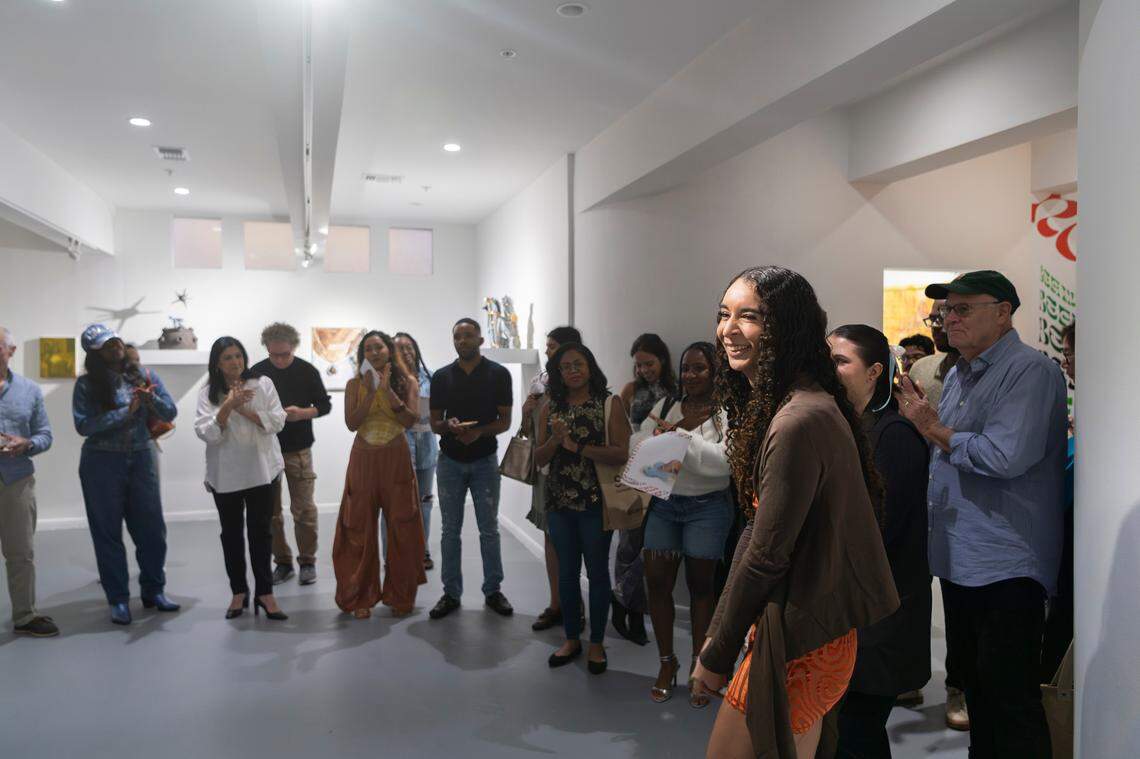 Curator Storm Ascher speaks at the opening night of “Bounce,” an art exhibition at Oolite Arts.