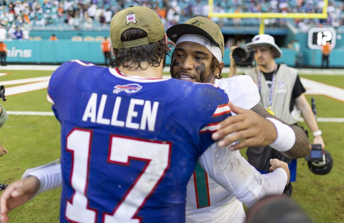 Miami Dolphins quarterback Tua Tagovailoa (1) and Buffalo Bills quarterback Josh Allen (17) hug after their NFL game at Hard Rock Stadium on Sunday, Nov. 9, 2025, in Miami Gardens, Fla. The Dolphins defeated the Bills.