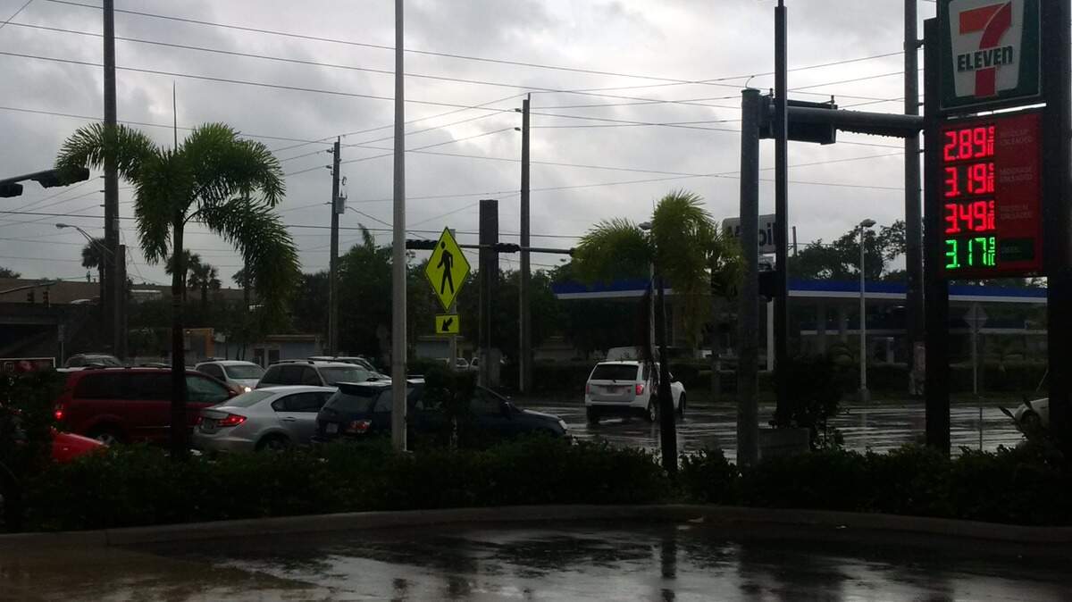 All the lights are blinking (they've stopped working) and the sky is gray between Tuesday morning's pounding rains at the intersection of Northwest 95th Street and Seventh Avenue.