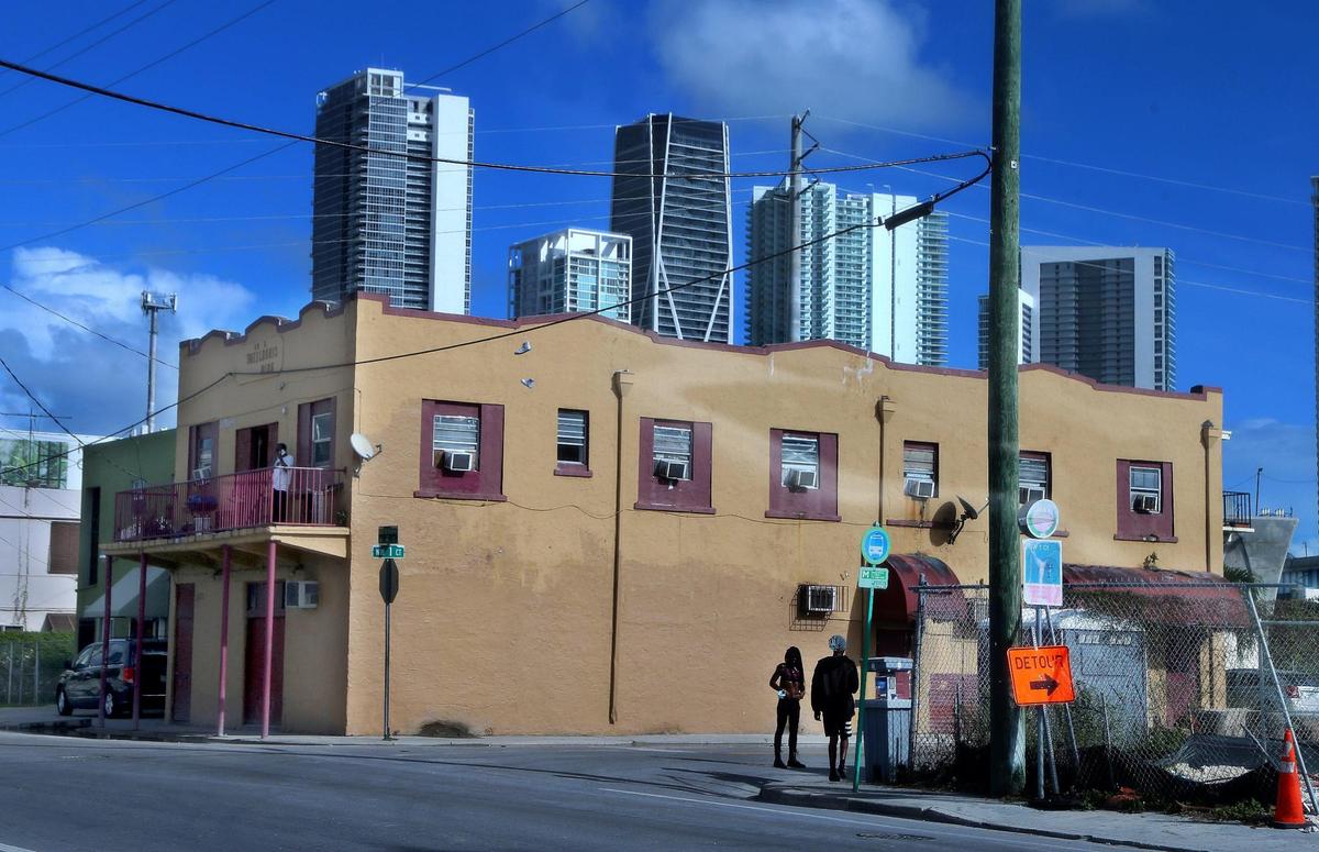 An Overtown apartment building at risk of hurricane damage is overshadowed by new high-rises on Thursday, October 6, 2020.