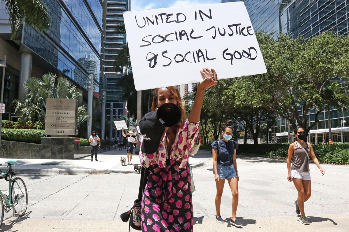 Ubah, 34, is seen marching down Brickell Avenue in Miami, Saturday, June 13, 2020.