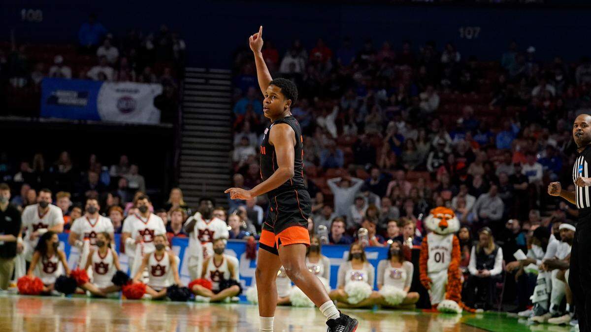 Miami guard Charlie Moore (3) celebrates after scoring during the second half of a college basketball game against Auburn in the second round of the NCAA tournament Sunday, March 20, 2022, in Greenville, S.C.