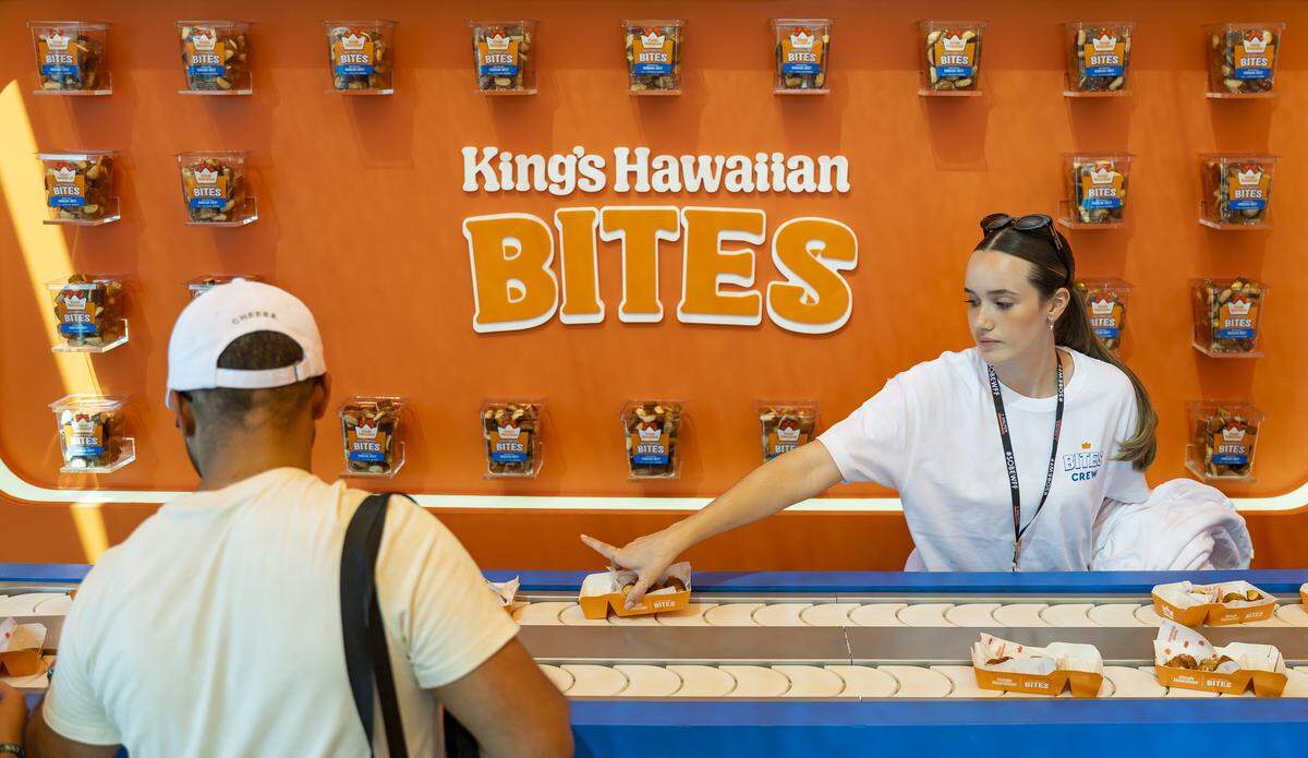 A King's Hawaiian Bites booth invites guests to snacks at the Goya Foods' Grand Tasting Village during the Food Network South Beach Wine & Food Festival on Saturday, Feb. 21, 2026, in Miami Beach, Fla.