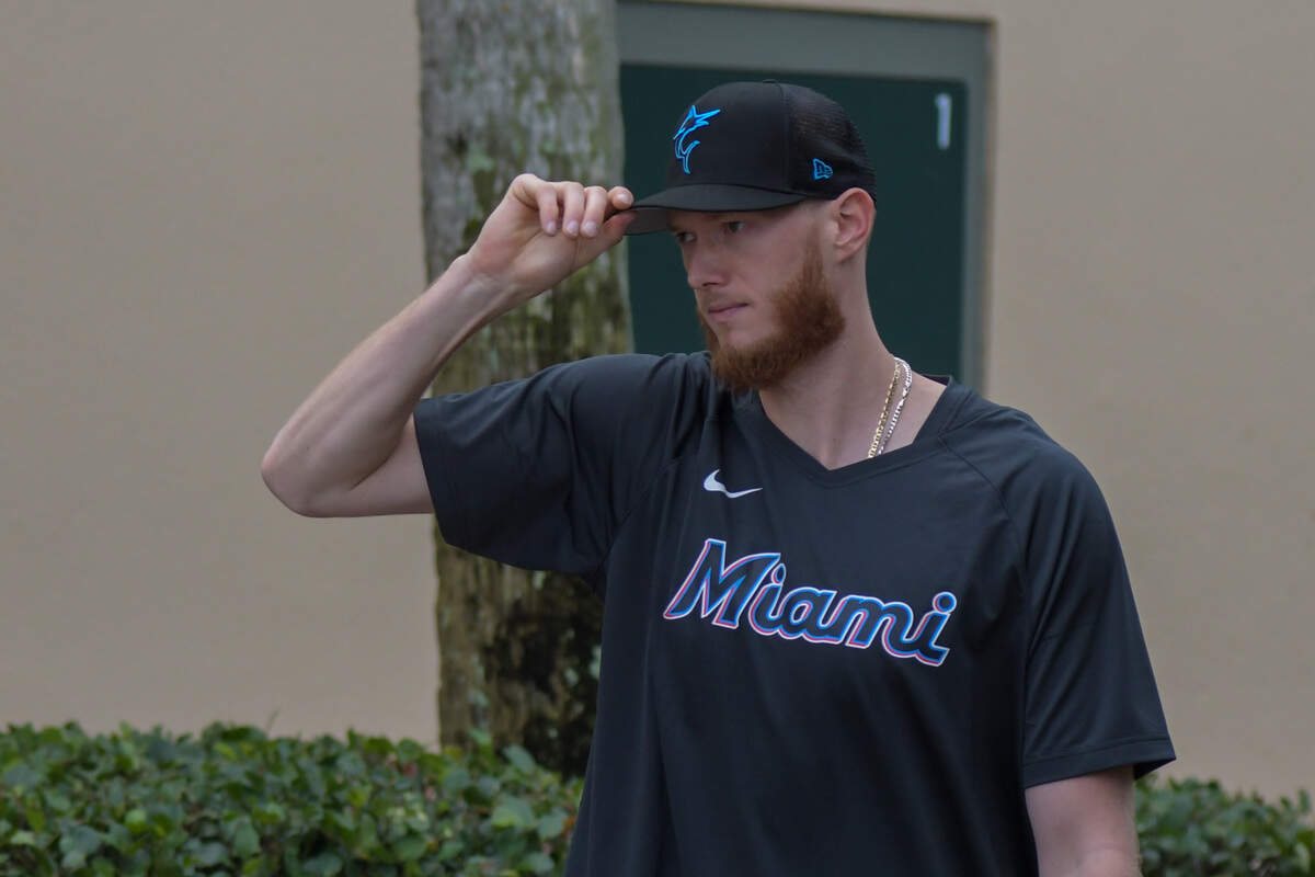 Miami Marlins left-handed pitcher A.J. Puk walks to the back fields of the Roger Dean Chevrolet Stadium complex in Jupiter, Florida, on Wednesday, Feb. 15, 2023.