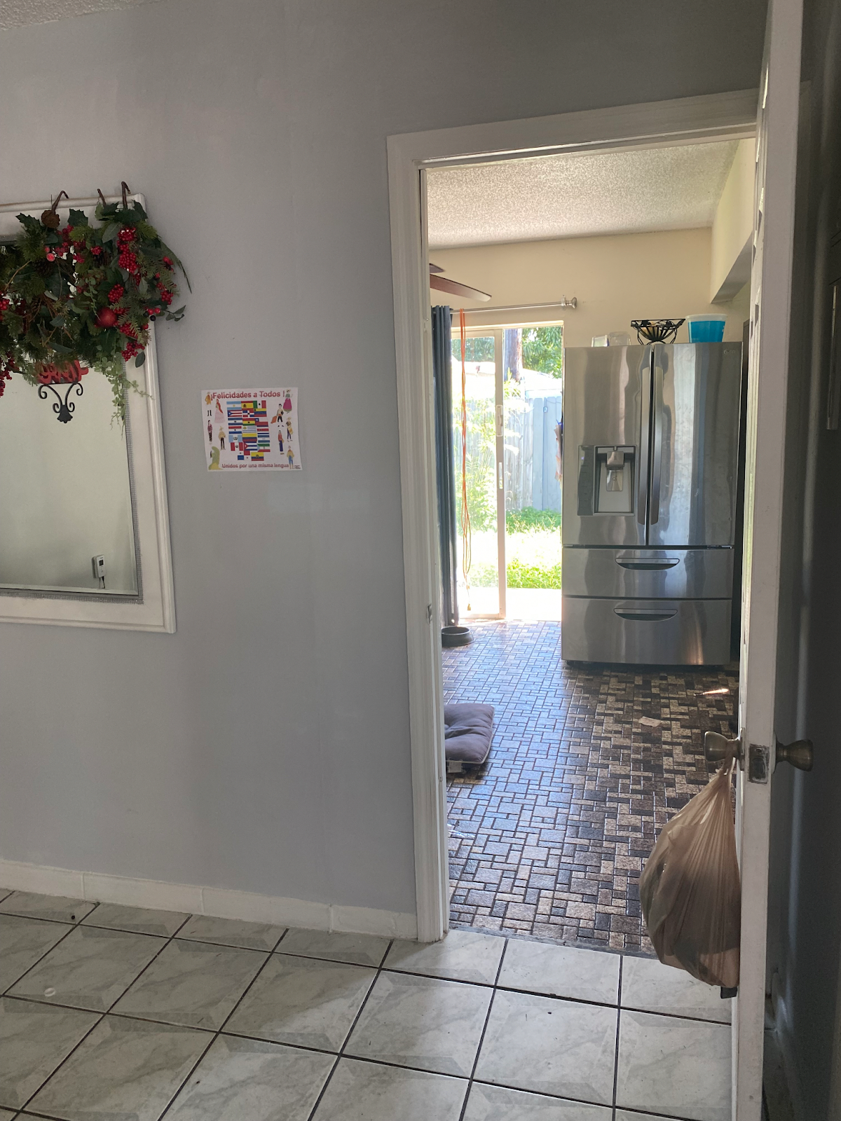 One of the participants in the study did not have a functioning AC system, so residents left the doors and windows open all summer to try and stay cool. Researchers installed a sensor, visible in the reflection, to measure how warm it got inside the home.