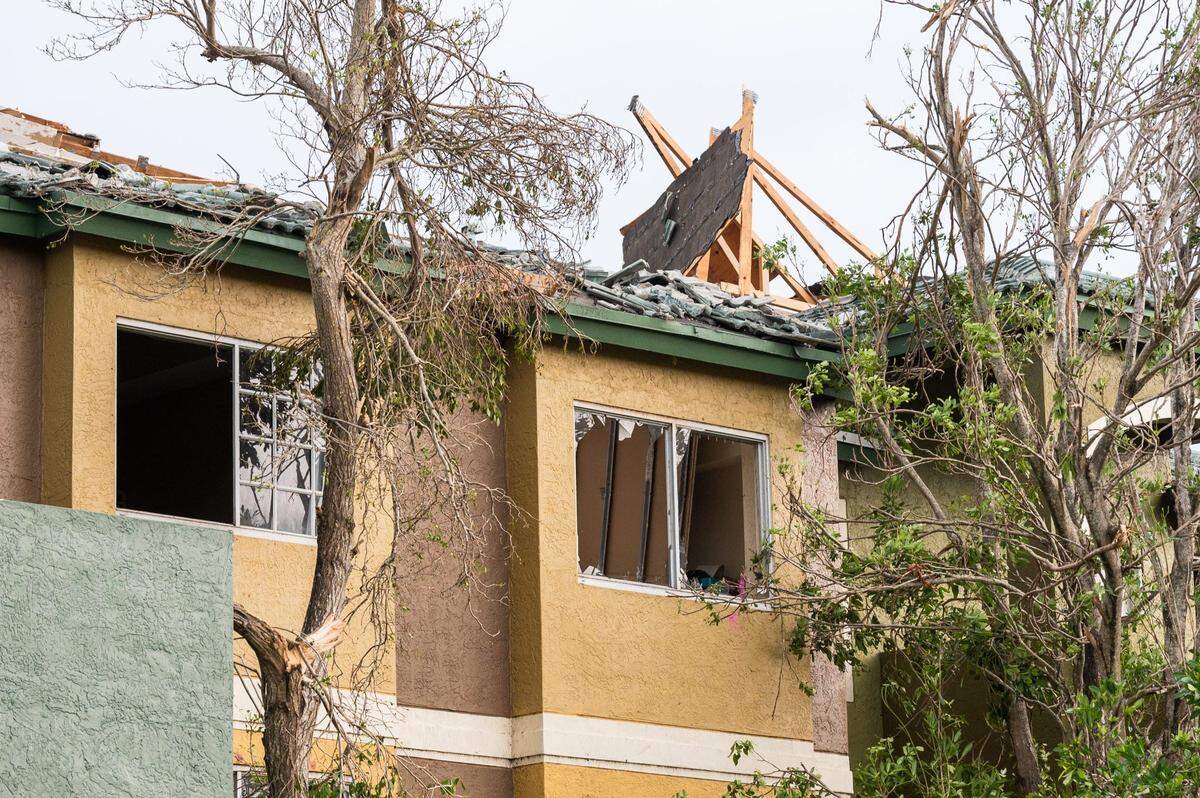 Blown-out windows and destroyed roof on a condemned building at the Sanctuary Cove Apartment complex on Sunday, April 30, 2023, in Palm Beach Gardens, Fla. The National Weather Service confirmed an EF-1 tornado touched down in Palm Beach Gardens Saturday evening.
