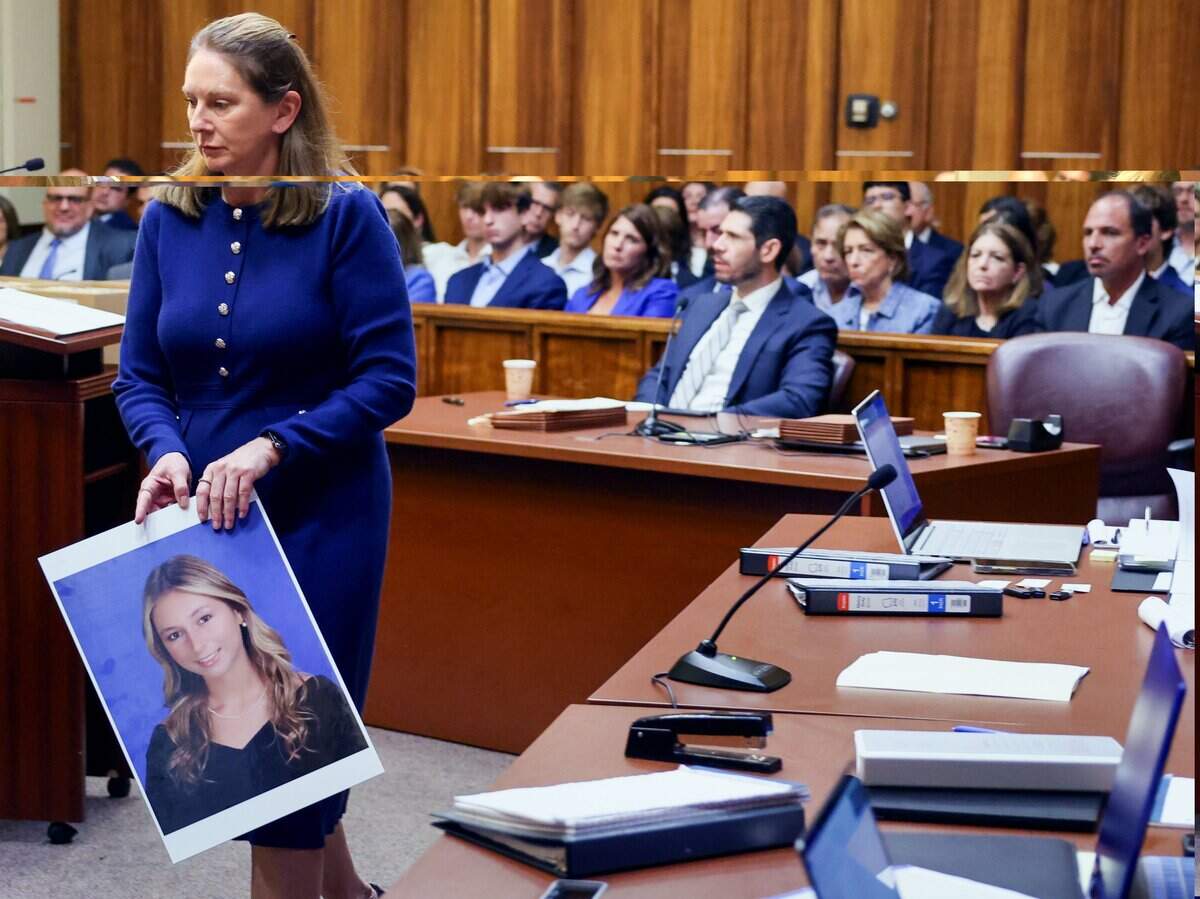 Prosecutor Laura Adams walks with a photo of Luciana ‘Lucy’ Fernandez prior to giving the State’s opening statement in the trial of George Pino, who is charged in connection to a Sept. 4, 2022, boat crash that killed the 17-year-old girl. Pino’s trial began on Monday, June 8, 2026.