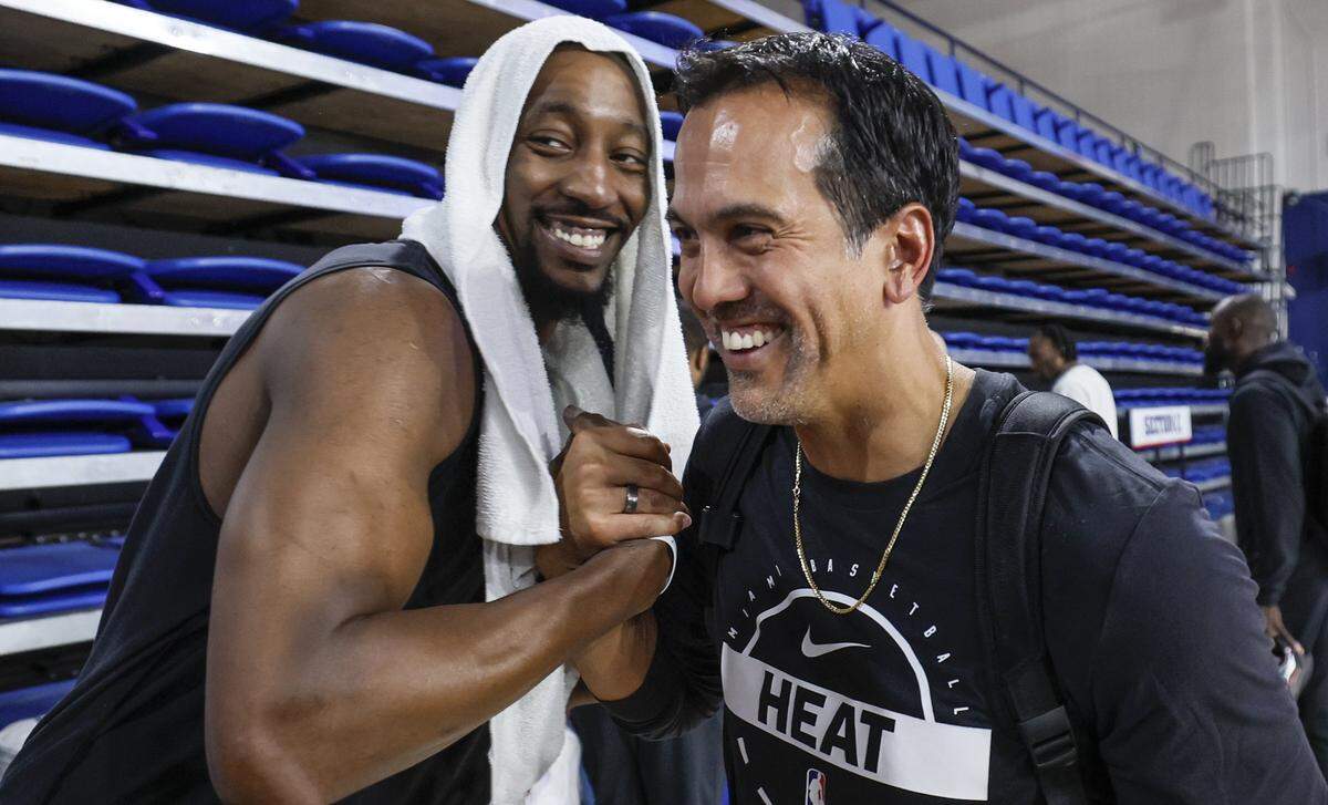 Miami Heat center Bam Adebayo (13) and coach Erik Spoelstra greet each other during training camp at Abessino Court at Eleanor R. Baldwin Arena at Florida Atlantic University in Boca Raton on October 2, 2025.