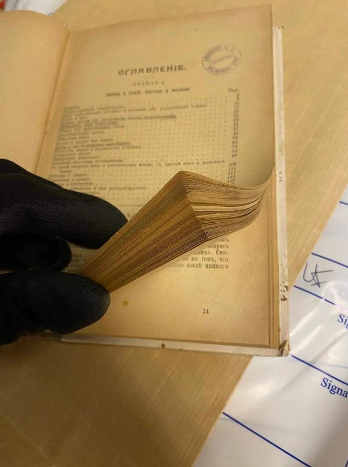 An antique book confiscated by police during the raids.
