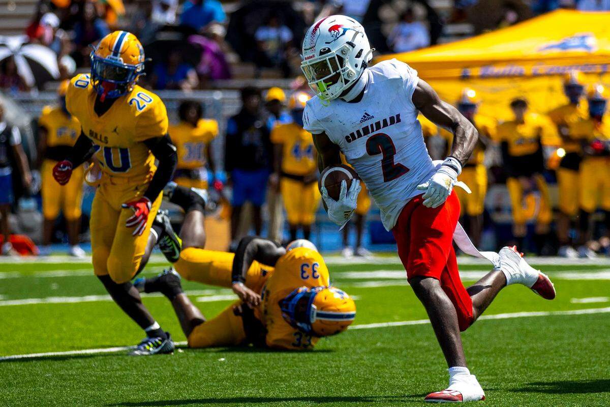 Chaminade-Madonna wide receiver Edwin Joseph (2) runs with the ball during the third quarter of a high school football game against Miami Northwestern Senior High at Nathaniel Traz Powell Stadium in Westview, Florida, on Saturday, September 10, 2022.