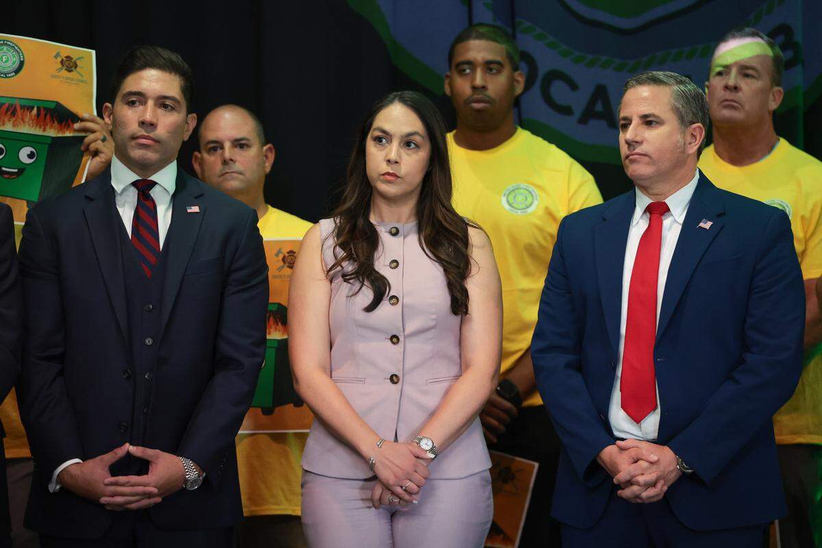 from left: Miami-Dade Commissioner Roberto J. Gonzalez, commissioner Natalie Milian Orbis, and Miami-Dade County Tax Collector Dariel Fernandez, look on during a press conference express opposition to a budget plan by Miami-Dade County Mayor Daniella Levine Cava at the Metro-Dade Firefighters Local 1403 union headquarters at 8000 NW 21 St. in Doral, Florida, Thursday, August 28, 2025. 