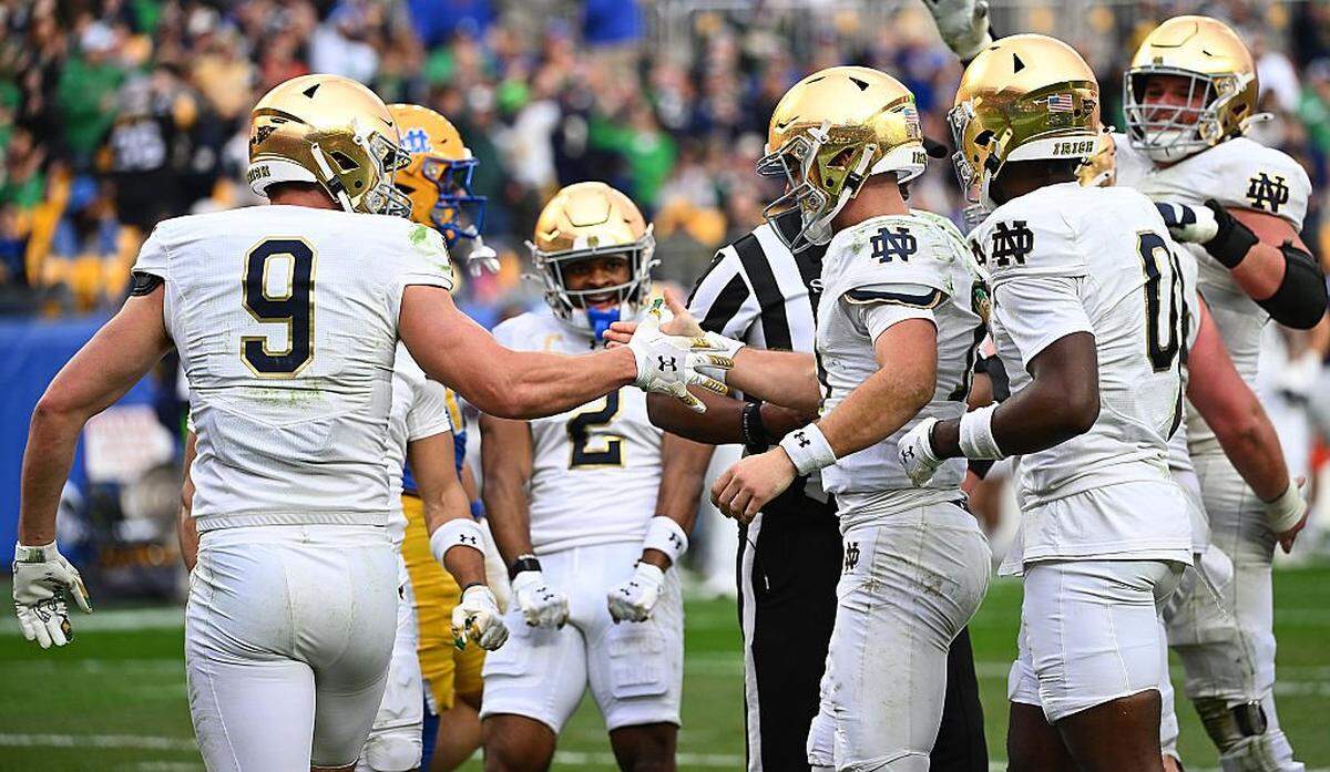 PITTSBURGH, PENNSYLVANIA - NOVEMBER 15: CJ Carr #13 of the Notre Dame Fighting Irish celebrates Eli Raridon #9 after rushing for a 5-yard touchdown in the second half during the game against the Pittsburgh Panthers at Acrisure Stadium on November 15, 2025 in Pittsburgh, Pennsylvania. (Photo by Justin Berl/Getty Images)