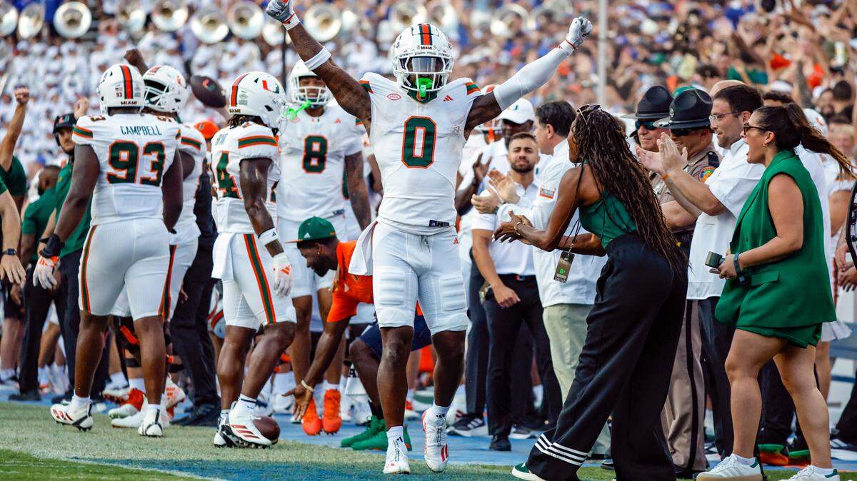 Miami Hurricanes defensive back Mishael Powell (0) reacts after intercepting the ball against the Florida Gators during the second half of an NCAA college football game at Ben Hill Griffin Stadium in Gainesville, Florida, on Saturday, August 31, 2024.