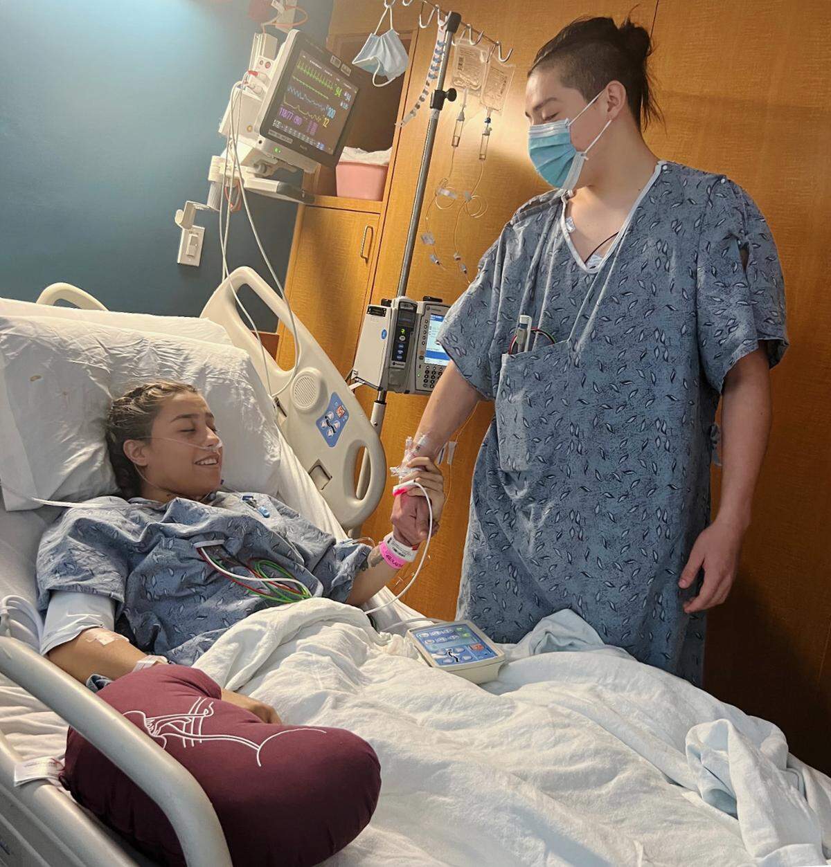 Kevin Calispa, right, visits his sister Brittany Calispa  after the surgery in which the kidney he donated was transplanted into her. 