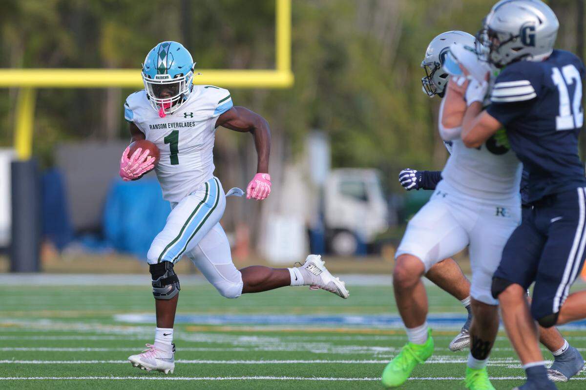 Ransom Everglades running back Noah Alce (1) carries the football against Gulliver Prep during the first quarter of a Region 4-2A quarterfinal football playoff game at Gulliver Prep in Pinecrest, Florida, Friday, Nov. 14, 2025.