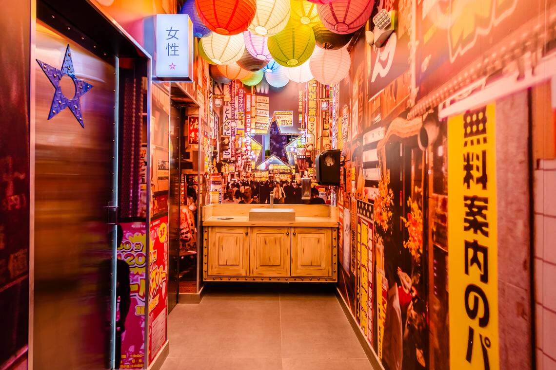 Tokyo Alley, the corridor to the restrooms at Nacionsushi, is designed to evoke a Japanese alley.