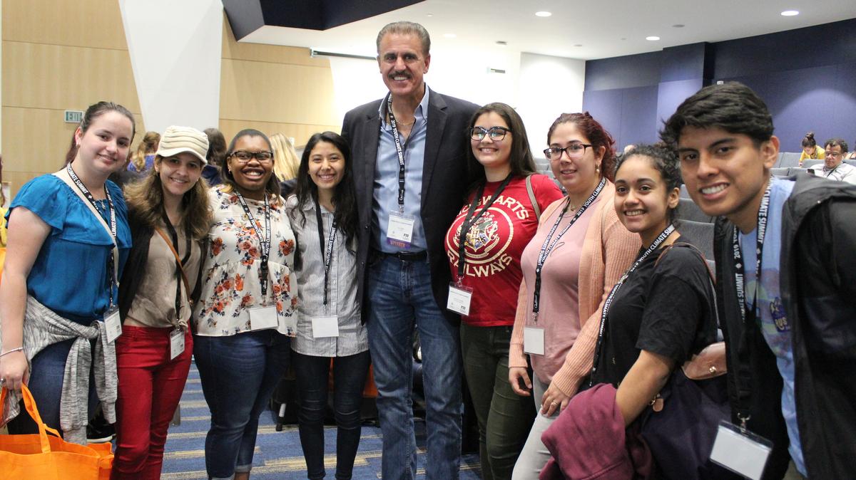Students from Gulliver Schools’ Field Studies Program celebrate with Zoo Miami’s Ron Magill, center, after hosting their first Youth Climate Summit at Florida International University. With nearly 100 students and teachers in attendance, the inaugural event encouraged youth to collaborate and fight climate change in Florida by establishing a Student Advisory Board.