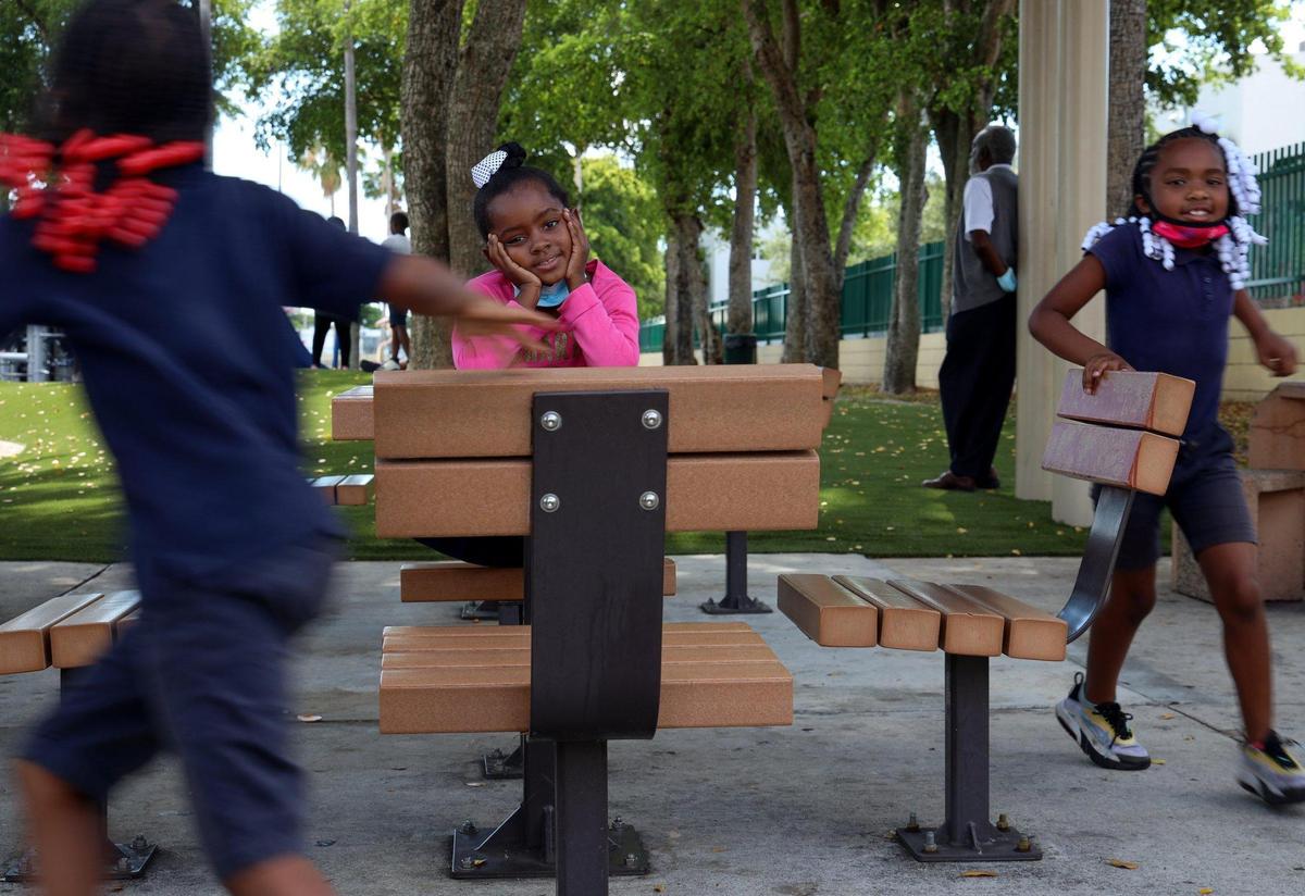 Samantha Quarterman, the executive director of MEYGA Learning Center, is someone who refuses to give up on her community and sees the value of educating the children. Sa’Miyah Figueroa, 6, left, Alaysia Mattox, 6, and Ma’Riyah Figueroa, right, play during recess on Thursday, May 6, 2021, at Liberty Square Park in Miami, Florida.