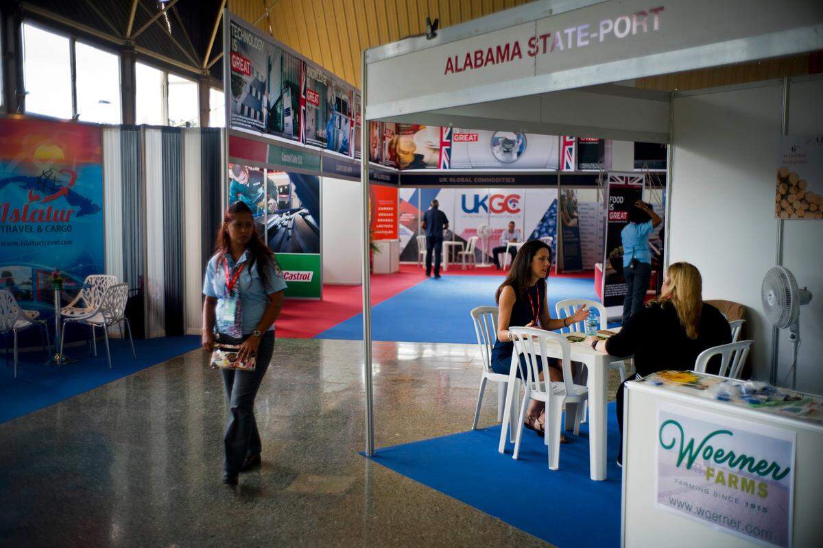 A woman walks past a stand representing Alabama at the 36th Havana International Fair.
