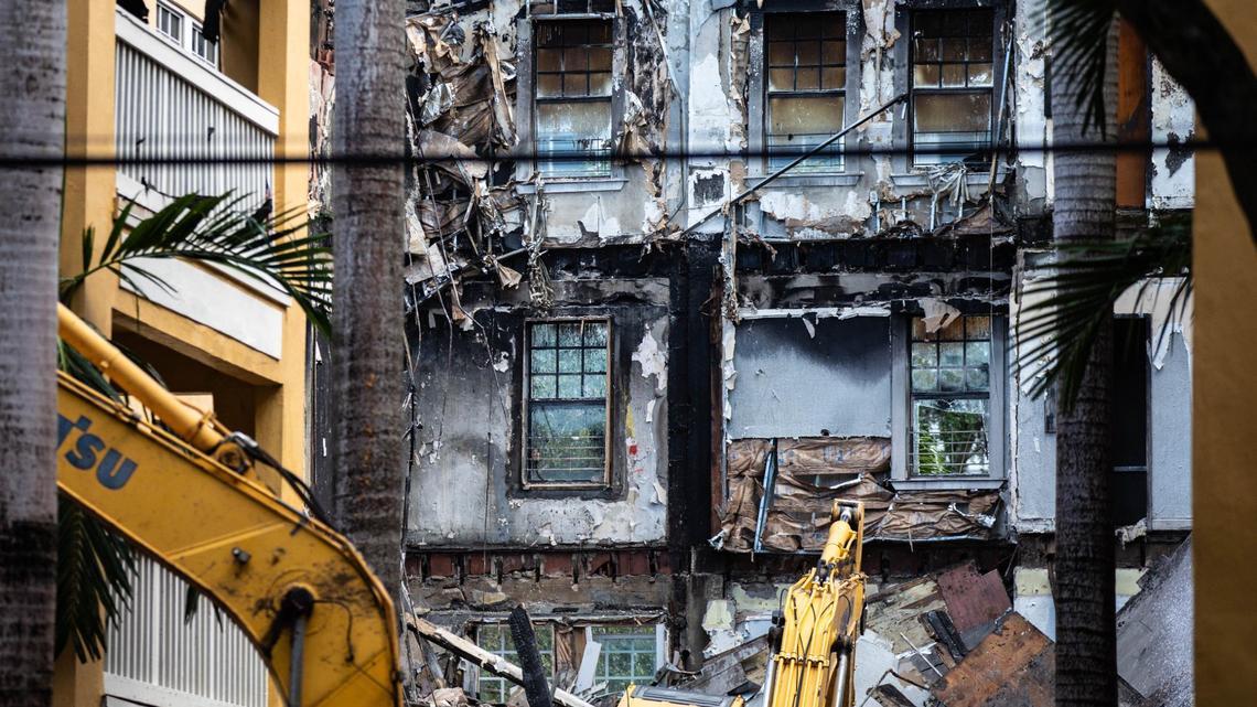 An excavator begins to demolish Temple Court Apartments, 431 NW Third St., Tuesday, June 18, 2024, in Miami, Fla. No implosions will be used to take down the complex. The city of Miami is demolishing the building after a fire swept through it last week. The demolition will take four to six weeks, Miami officials said.