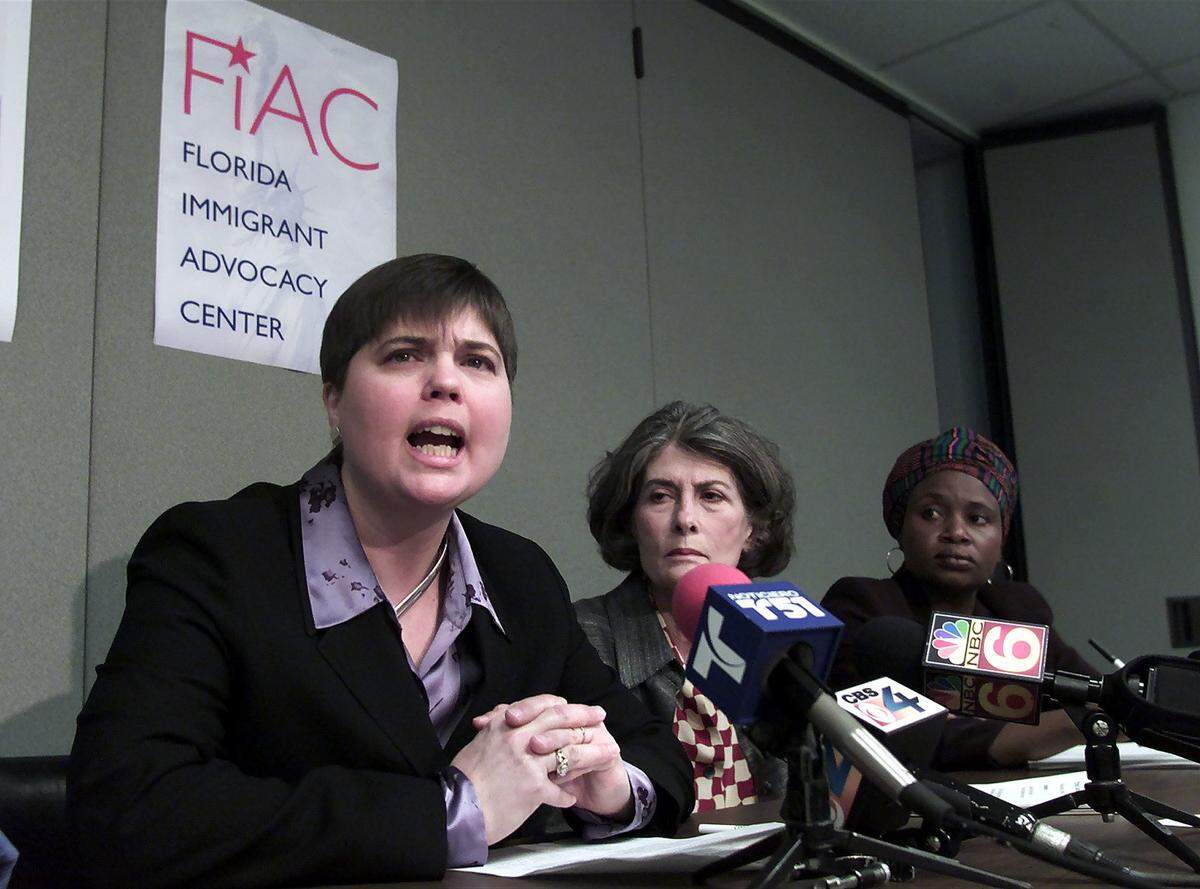 In this file photo from Feb. 7, 2001, asylum seekers speak out about what they called deplorable conditions for women at the Turner Guilford Knight Correctional Center in Miami. INS detained women transferred to the center, allegedly for their own safety, were instead imprisoned in appalling conditions, housed in cells and restricted access to lawyers, received poor medical care and had little or no contact with their families. Pictured left to right are Wendy Young, director of US Programs Women’s Commission for Refugee Women and Children, Janet McAliley, a board member of The Florida Immigrant Advocacy Center (now known as Americans for Immigrant Justice) and Marleine Bastien, president of Haitian Women of Miami.