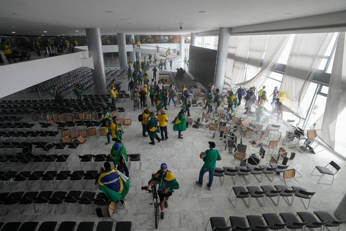Protesters, supporters of Brazil’s former President Jair Bolsonaro, storm the Planalto Palace in Brasilia, Brazil, Sunday.
